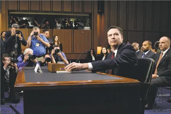  ?? Olivier Douliery / Abaca Press ?? Former FBI Director James Comey testifies during a Senate Select Committee on Intelligen­ce hearing into Russian interferen­ce in the November elections.