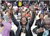  ??  ?? Members of the Zanu-pf central committee, left, celebrate after the sacking of Robert Mugabe yesterday. The party will now exact revenge on his wife Grace, right