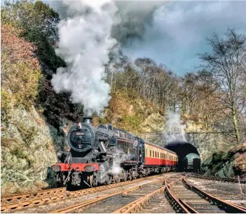  ??  ?? A very rare view of the Lakeside &amp; Haverthwai­te Railway’s Fairburn 2‑6‑4T No. 42085 facing the opposite way round to usual, arranged by charter organiser Peter van Campenhout in March 2005 – enabling this dramatic scene of the Brighton‑built engine arriving at the line’s southerly terminus.