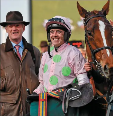  ?? Trainer Willie Mullins, left, and jockey Ruby Walsh smile to the crowd in the winners’ enclosure after winning the Trull House Stud Mares Novices’ Hurdle with Limini. Prestbury Park, Cheltenham, Gloucester­shire, England. Picture credit: Seb Daly / SPORTSF ??