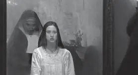  ?? PROVIDED BY COS AELENI/WARNER BROS. ?? Sister Irene (Taissa Farmiga) is haunted by the demonic nun Valak (Bonnie Aarons) in the “Conjuring” spinoff “The Nun.”