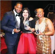  ?? NWA Democrat-Gazette/JOCELYN MURPHY ?? Winners Jodie Franklin (left) for small business, Julie Joyce, winner of the High Hoof award, and Tracey Brown for large business pose with their awards after kissing the pig on March 11.