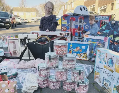  ??  ?? with some of the Christmas presents for homeless children in Sunderland.