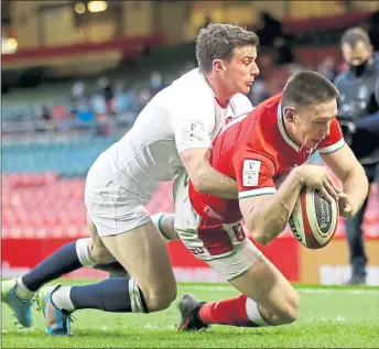  ??  ?? Josh Adams goes over for Wales’ opening try