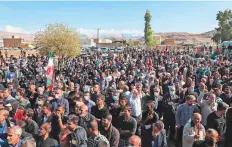  ?? AFP ?? Iranians in the funeral procession of people killed in a shooting attack in the city of Izeh in Iran’s Khuzestan province.