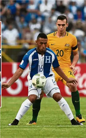  ?? — AFP ?? Tight marking: Australia’s Trent Sainsbury (right) vying for the ball with Honduras’ Alex Lopez during their World Cup playoff first-leg match in San Pedro Sula, Honduras, on Friday. Inset: Tim Cahill.
