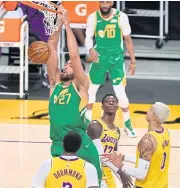  ?? USA TODAY SPORTS ?? Utah’s Rudy Gobert, No.27, scores against the Lakers.