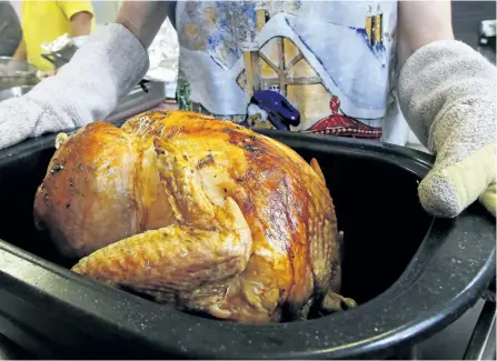  ?? CLIFFORD SKARSTEDT/EXAMINER FILE PHOTO ?? Chef Brian Henry has some tips on how to create the perfect Christmas turkey this year. One of his tips involves brine, which makes it more moist and tender.