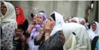  ?? – Reuters ?? PAIN AND GRIEF: Women react before a joint burial of victims in Potocari near Srebrenica, Bosnia and Herzegovin­a.