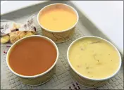  ??  ?? From left, vegan butternut squash bisque, left, lobster bisque, center back, and New England clam chowder, right, are among several chowders and bisques available to choose from for the Chowder Tasting Trio during Chowder Days at the Mystic Seaport Museum.