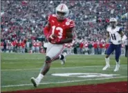  ?? JAE C. HONG — THE ASSOCIATED PRESS ?? Ohio State tight end and Northeast Ohio native Rashod Berry scores against Washington during the first half of the Rose Bowl on Jan. 1 in Pasadena, Calif.