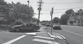  ?? USA TODAY NETWORK ?? Cars line a street in Wilmington, Del., for COVID-19 testing.