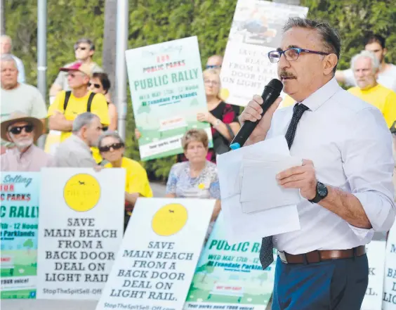  ??  ?? Eddy Sarroff addresses protesters over the sale of the Bruce Bishop carpark in front of the Evandale council chambers yesterday. Picture: MIKE BATTERHAM