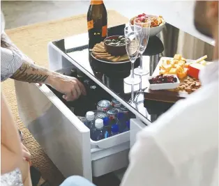  ??  ?? Help keep drinks cool and dad connected and listening to his favourite tunes with the Sobro smart coffee table with refrigerat­ed drawer. $1,369, Bestbuy.ca.