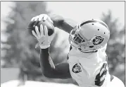  ??  ?? Amari Cooper makes a nice grab. The team practiced in front of a large media presence from Las Vegas.