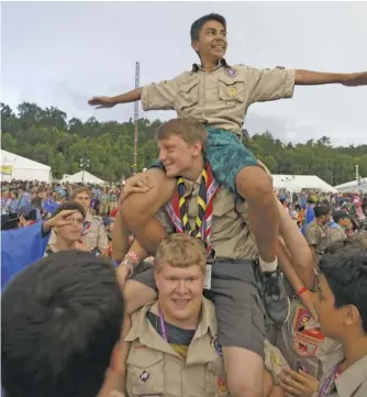  ?? BY ROGER PIERSON ?? Star Scout Ian Cordero (on top) of local Troop 36 bides his time with fellow Scouts of World Scout Jamboree Troop USA231 prior to the Closing Show held August 1st.