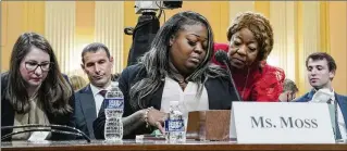  ?? SHURAN HUANG/THE NEW YORK TIMES 2022 ?? Georgia election workers Wandrea “Shaye” Moss (center) and her mother, Ruby Freeman, testify to a panel in Congress investigat­ing the attack on the U.S. Capitol about how they were threatened by Trump supporters who believed lies claiming the election was “stolen.”