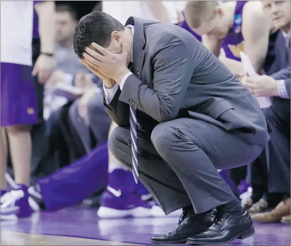  ?? — THE ASSOCIATED PRESS FILES ?? Northern Iowa head coach Ben Jacobson covers his face with his hands Sunday during the second round of the NCAA tournament. Northern Iowa fell victim to the largest last-minute comeback in U.S. college basketball history at the hands of Texas A&M.
