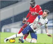  ??  ?? Tottenham Hotspur's Welsh defender Joe Rodon (R) takes on Liverpool's Senegalese striker Sadio Mane (L) during the match