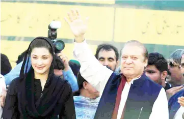  ??  ?? File photo shows Nawaz (right) gesturing to supporters as his daughter Maryam looks on during party’s workers convention in Islamabad, Pakistan. — Reuters photo