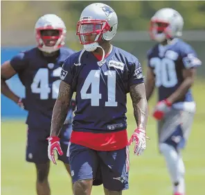  ?? STAFF PHOTO BY JOHN WILCOX ?? WAIT FOR IT: Defensive back Cyrus Jones gets ready for a drill during yesterday’s minicamp session in Foxboro.