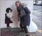  ??  ?? „ Art lovers have been queuing up for a glimpse of the Banksy in Port Talbot and new image, left, in Edinburgh.