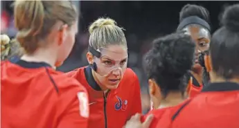  ?? ETHAN MILLER/GETTY IMAGES ?? Elena Delle Donne wears a facemask after breaking her nose in July.