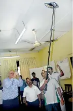  ??  ?? How in Sri Lanka gutters are checked for water collection which could in turn become ideal breeding grounds for mosquitoes, is demonstrat­ed to Prof. Scott Ritchie at the office of the Colombo East Medical Officer of Health