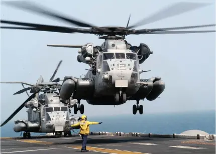  ?? Photo by Handout / US NAVY / AFP ?? This US Navy handout photo provided March 30, 2003 shows a CH-53E ‘Super Stallion’ helicopter aboard the amphibious assault ship USS Kearsarge