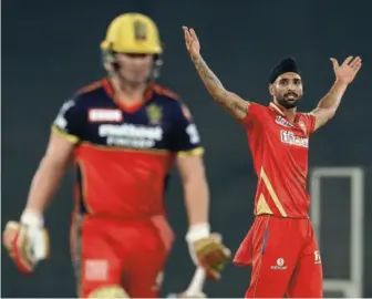  ?? SPORTZPICS / IPL ?? Getting the big fish: Punjab’s leftarm spinner Harpreet Brar celebrates after the dismissal of Royal Challenger­s’ AB de Villiers. Harpreet accounted for the dismissals of two other giants — Virat Kohli and Glenn Maxwell.