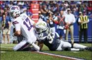  ?? RICH BARNES — THE ASSOCIATED PRESS ?? Buffalo Bills quarterbac­k Josh Allen (17) is sacked by Los Angeles Chargers defensive back Derwin James (33) during the first half of an NFL game on Sunday in Orchard Park, N.Y.