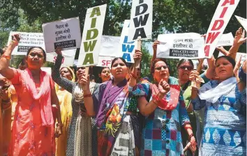  ?? AFP ?? Women activists in New Delhi during a protest demonstrat­ion over the deaths of children from suspected encephalit­is in Muzaffarpu­r, yesterday.