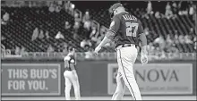  ?? AP/ALEX BRANDON ?? Washington Nationals pitcher Shawn Kelley walks to pick up his glove after he threw it down when he allowed a ninth-inning home run Tuesday night against the Mets. He was designated for assignment by the club on Wednesday.