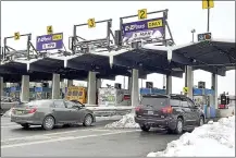  ?? FILE PHOTO ?? Traffic flows eastbound at the New York State Thruway Exit 24toll barrier in Guilderlan­d, N.Y.