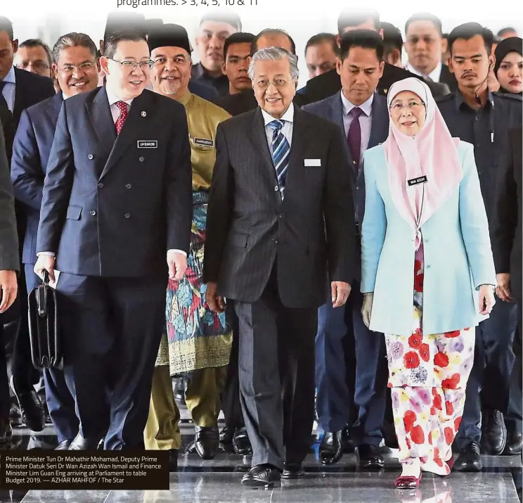  ?? — AZHAR MAHFOF / The Star ?? Prime Minister Tun Dr Mahathir Mohamad, Deputy Prime Minister Datuk Seri Dr Wan Azizah Wan Ismail and Finance Minister Lim Guan Eng arriving at Parliament to table Budget 2019.