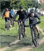  ?? Picture: Alon Skuy ?? Cyclists ride through Braamfonte­in Spruit in Johannesbu­rg where there has been an increase in attacks and robberies.