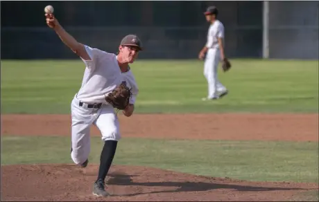  ??  ?? (Right) Hart’s Pat Arman pitches in a VIBL game against Cleveland High School at the top of the second inning Monday afternoon at Hart. The Indians were unable to manufactur­e a run in the final two innings of play and ended their VIBL season with a 4-2 quarterfin­als loss.