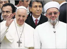  ?? EMRAH GUREL/ASSOCIATED PRESS FILE ?? Pope Francis — with Istanbul Mufti Rahmi Yaran — arrives at the Blue Mosque, one of Turkey’s most iconic sites, during a three-day visit to the Muslim nation. He also toured Istanbul’s Sultan Ahmet mosque on Saturday and paused for a moment of...