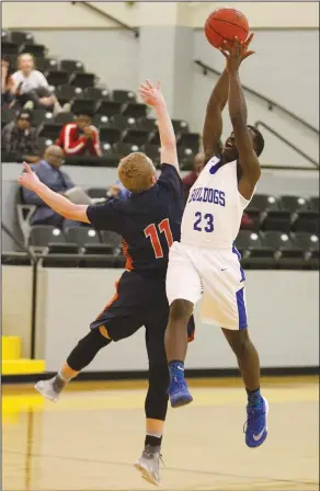  ?? Terrance Armstard/News-Times ?? Nice catch: Strong's Jadarrius Dixon catches a pass above Trinity Christian’s Jakob Martin (11) during the first round of the 5-1A Regional Tournament in Hampton Wednesday. Strong clinched a spot in the state tournament with a 74-58 win.