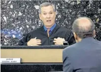  ??  ?? Judge Joseph Marx speaks to Sheila Keen-Warren’s attorney Richard Lubin during a pre-trial hearing at the Palm Beach County Courthouse.