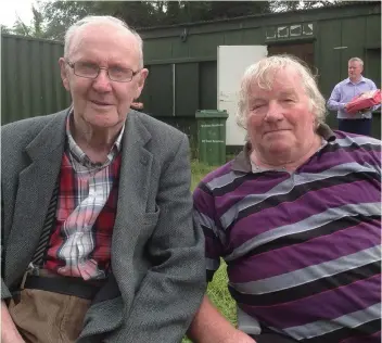  ??  ?? Glencormac United’s first manager, in 1974, Tommy Devlin with lifelong member and current chairman Christy Devlin keeping an eye on proceeding­s at the Glencormac United soccer camp.