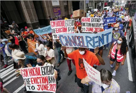  ?? MARY ALTAFFER—ASSOCIATED PRESS ?? Activist march across town towards New York Gov. Kathy Hochul office, Tuesday, Aug. 31, 2021, in New York, during a demonstrat­ion to call on Hochul, Speaker Carl Heastie, and Senate Majority Leader Andrea Stewart-cousin to extend pandemic era eviction protection­s in wake of Supreme Court decision lifting the moratorium.