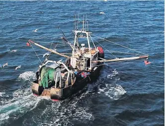  ?? CONTRIBUTE­D ?? A fishing trawler makes its way to open water from Montauk, N.Y., for a day trip to fish off the coast of Long Island in this 2017 file photo. The ocean’s health is sparking concern for Canadian consumers who want to see more sustainabl­e practices in ocean harvesting.