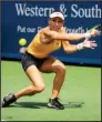  ?? The Associated Press ?? ROMANIAN RALLY: Simona Halep of Romania returns a serve from Ekaterina Alexandrov­a of Russia on Center Court at the Western & Southern Open Wednesday in Mason, Ohio. Halep advanced in three sets 3-6, 7-5, 6-4.