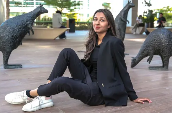  ?? Victor Besa / The National ?? Madeeha Hussain, who is in her third year at university, says that having a job has given her independen­ce, a sense of pride and work ethic