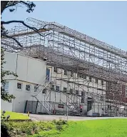  ?? SIMON O’CONNOR/STUFF ?? New Plymouth Girls’ High School’s B Block is having earthquake strengthen­ing and reroofing done.