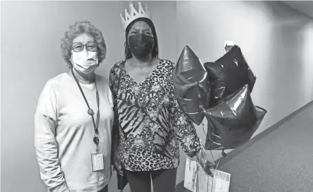  ?? PROVIDED BY KENT COUNTY HEALTH DEPARTMENT ?? Staff from the Kent County Health Department celebrated — and a few cried — when Shelley Grissom of Grand Rapids received the department’s 20,000th COVID-19 vaccine, said long-time public health nurse Mary Wisinski.