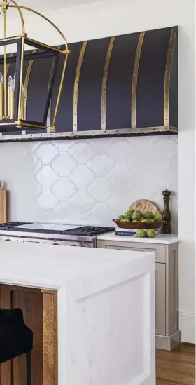  ??  ?? (opposite and above, left) The modern farmhouse kitchen is all about functional beauty. “The oversized pendants and backsplash tile balance the large range hood,” the team says. “And did we mention that it took eight men to install the range hood?”