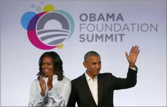  ?? CHARLES REX ARBOGAST — THE ASSOCIATED PRESS FILE ?? In this file photo, former President Barack Obama, right, and former first lady Michelle Obama arrive for the first session of the Obama Foundation Summit in Chicago.