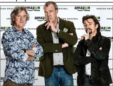  ??  ?? Back in the driving seat: May, Clarkson and Hammond yesterday announce their Amazon deal